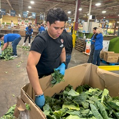 2024-11-20 Carlos Martinez of City Theatrical volunteering at Hillside Foodbank in Hillside, New Jersey