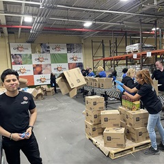 2024-11-20 Carlos Martinez (left) and Iliana Angel (right) with members of City Theatrical volunteering at Hillside Foodbank in Hillside, New Jersey